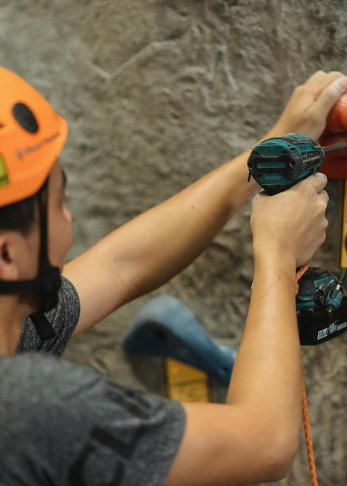Professional instructor Olesia Verbova smiling in gym gear